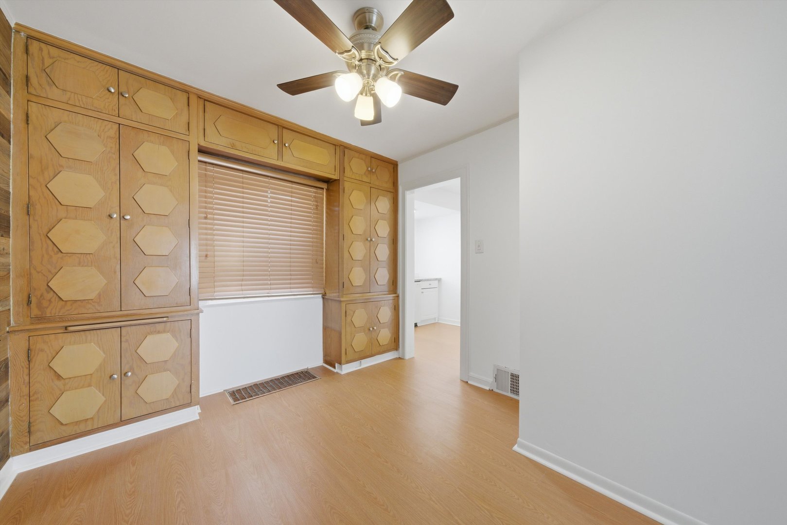 3941 North Mobile Avenue Chicago, IL 60634 - Photo 15 of 46 a view of a livingroom with a chandelier fan