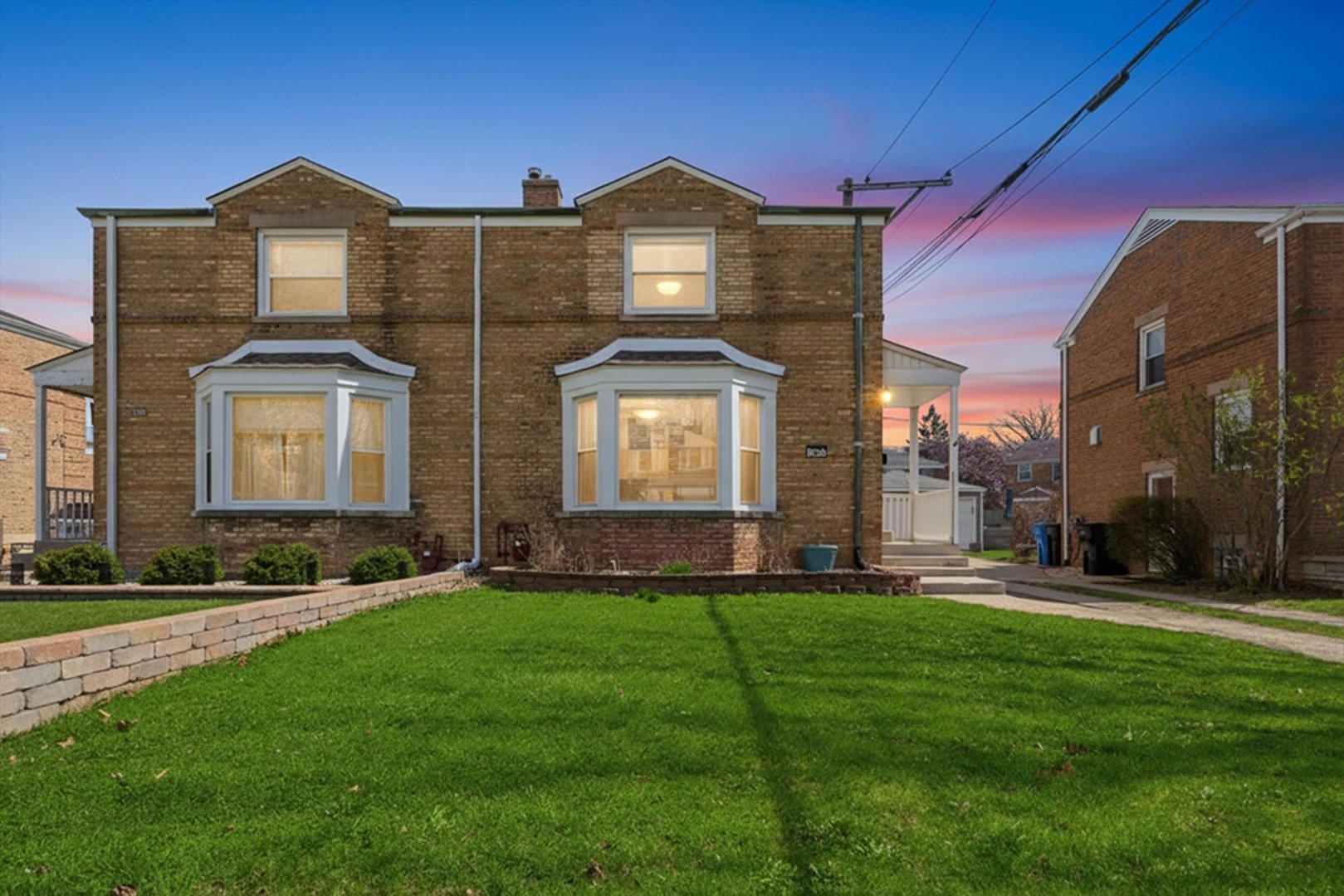 3941 North Mobile Avenue Chicago, IL 60634 - Photo 2 of 46 a front view of a house with a yard