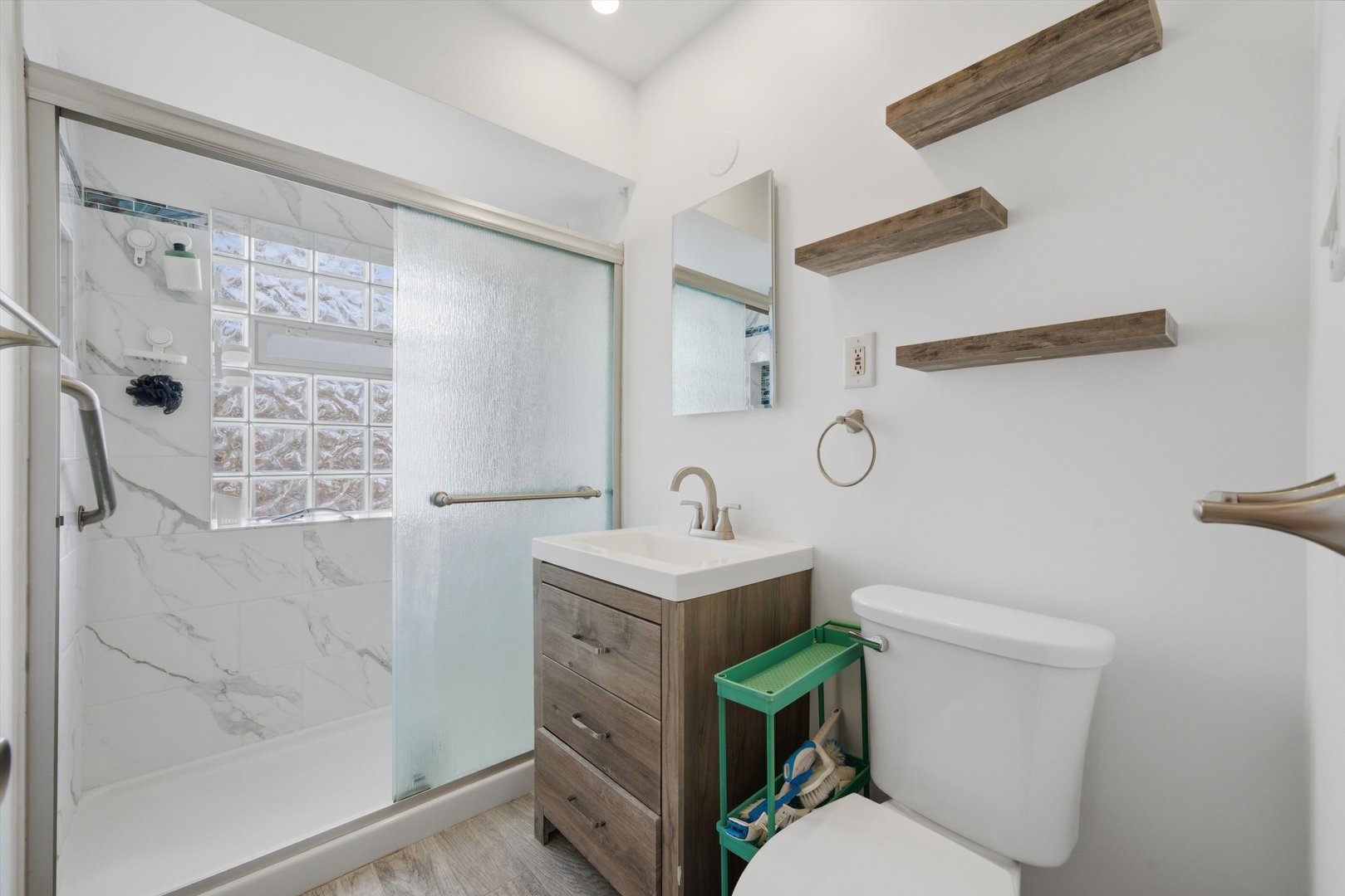 3941 North Mobile Avenue Chicago, IL 60634 - Photo 21 of 46 a bathroom with a sink toilet and shower