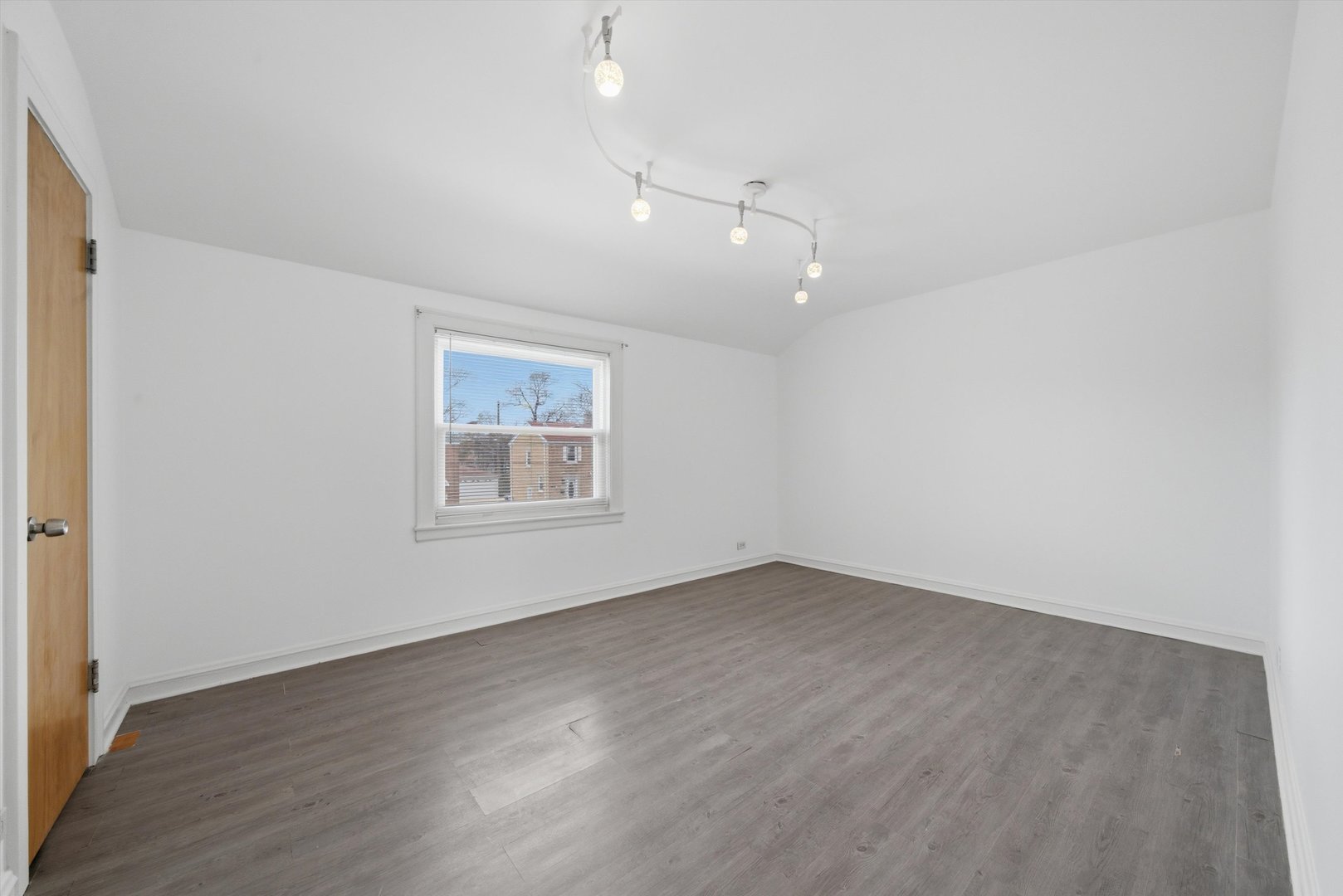 3941 North Mobile Avenue Chicago, IL 60634 - Photo 22 of 46 an empty room with wooden floor and windows