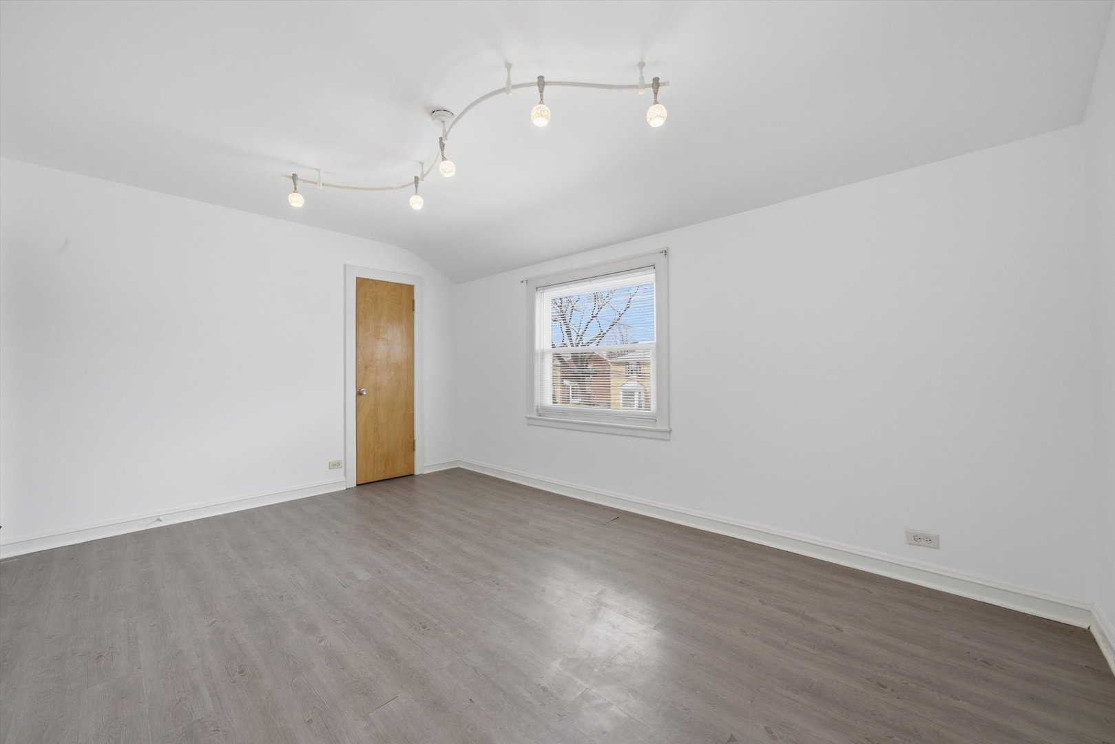 3941 North Mobile Avenue Chicago, IL 60634 - Photo 24 of 46 an empty room with wooden floor and windows