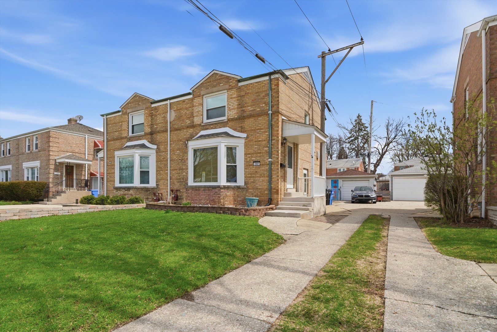 3941 North Mobile Avenue Chicago, IL 60634 - Photo 3 of 46 a view of a building with a yard
