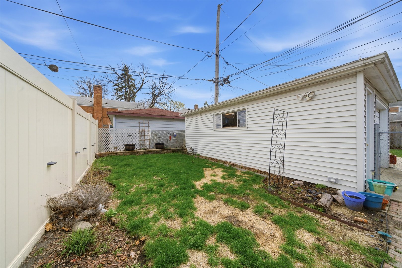 3941 North Mobile Avenue Chicago, IL 60634 - Photo 33 of 46 a view of a backyard with plants and a patio
