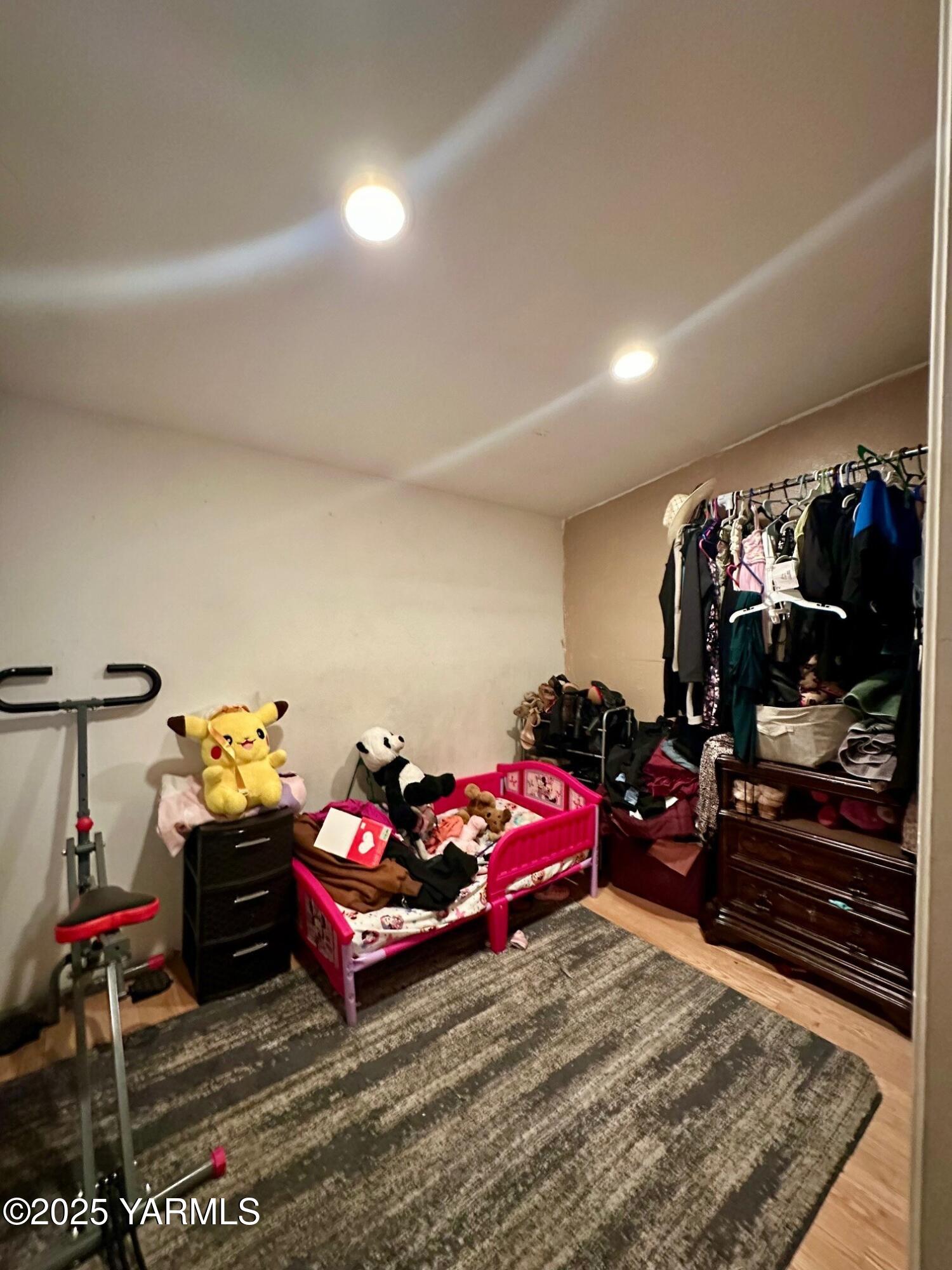 1504 South 14th Street Yakima, WA 98901 - Photo 8 of 11 a bedroom with furniture and a flat screen tv