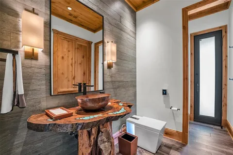 a dining room with furniture and wooden floor