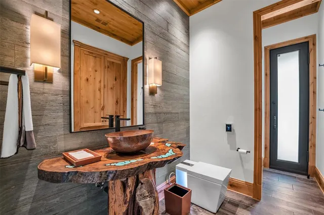 a dining room with furniture and wooden floor