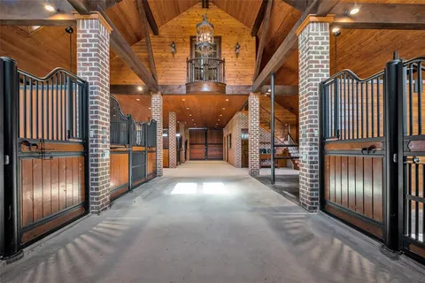 a view of a brick house with many windows