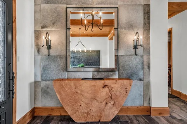 a view of a bathroom with a bathtub and mirror