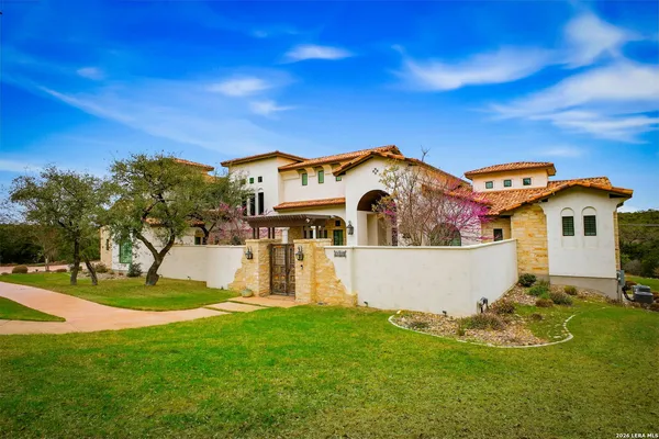 an aerial view of a house with a yard