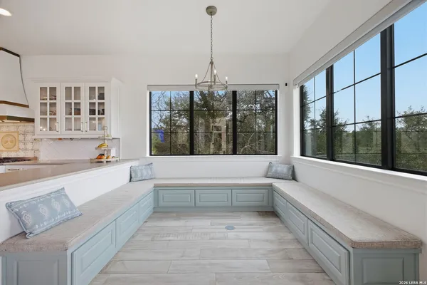 a spacious bathroom with a sink a mirror and a shower