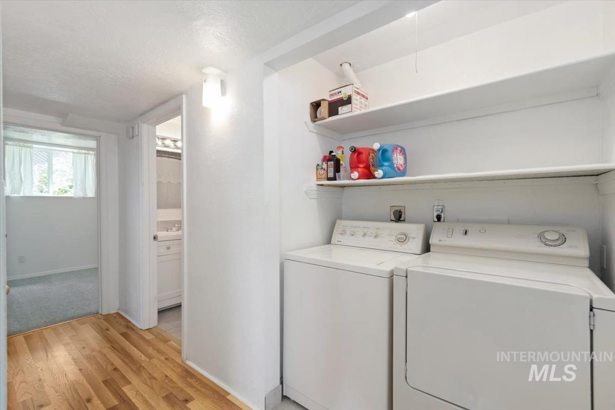 10178 West Fox Ridge Drive Boise, ID 83709 - Photo 20 of 36 Dedicated laundry area with built-in shelving, providing convenience and storage solutions