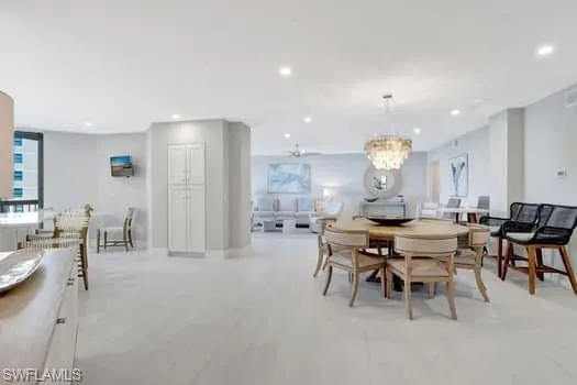 a large dining space with furniture and a large window