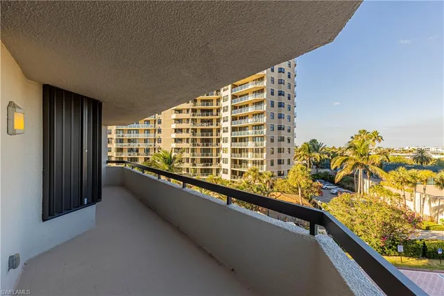 a view of balcony with a potted plant