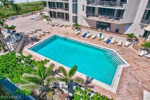 a view of a pool with a yard