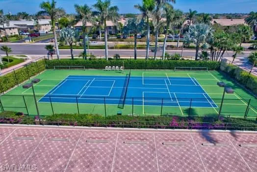 a view of yard with swimming pool and green space