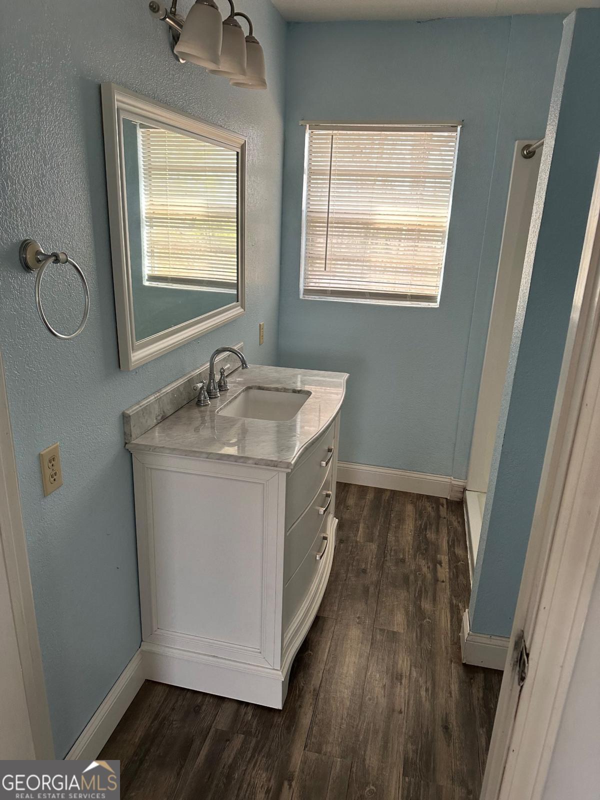 160 Macon Road McIntyre, GA 31054 - Photo 12 of 22 a bathroom with a granite countertop sink toilet and mirror