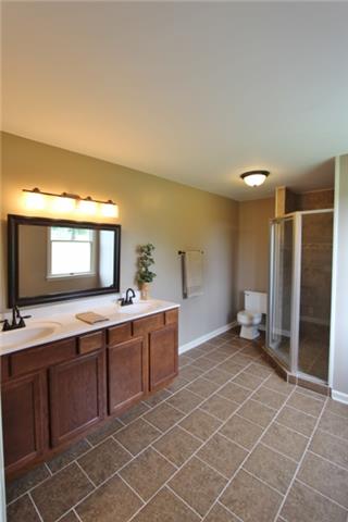 7150 Franklin Road Lebanon, TN 37090 - Photo 12 of 20 master bathroom with tile, granite, double vanities and large custom tile shower