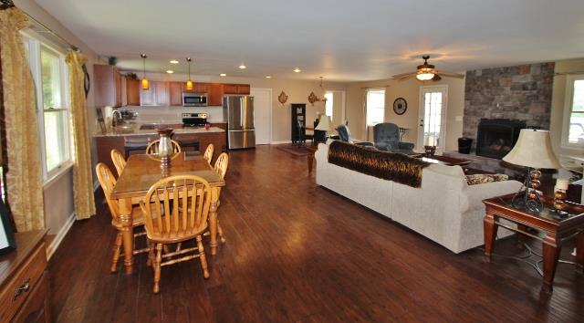 7150 Franklin Road Lebanon, TN 37090 - Photo 8 of 20 Another view of open den/kitchen/dining area with gorgeous wood burning rock fireplace
