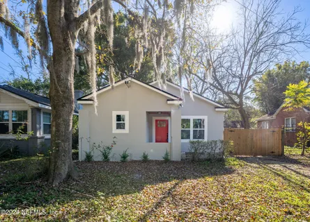 a house with trees in the background
