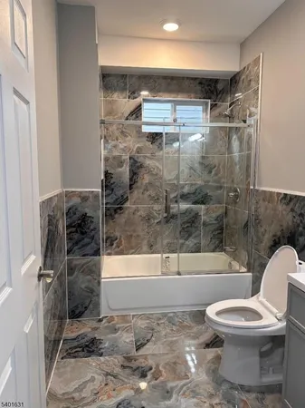 a bathroom with a shower and a toilet