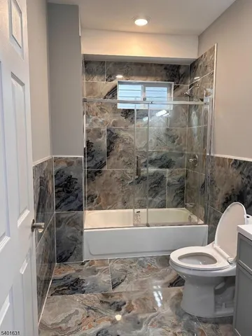 a bathroom with a shower and a toilet
