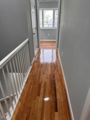 a view of balcony with wooden floor