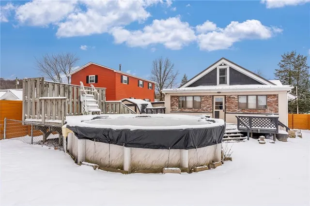 a view of a house with large trees