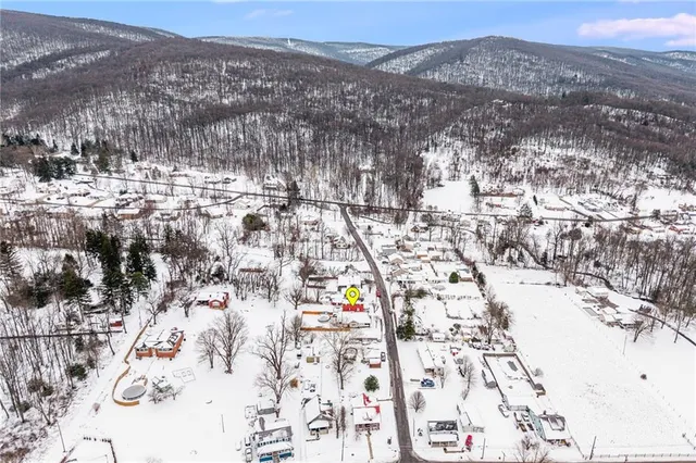 a kitchen with stainless steel appliances granite countertop a refrigerator stove and sink