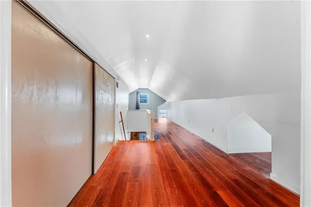 a bathroom with a granite countertop sink mirror and shower