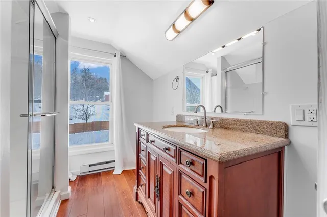 a view of a livingroom with wooden floor and closet
