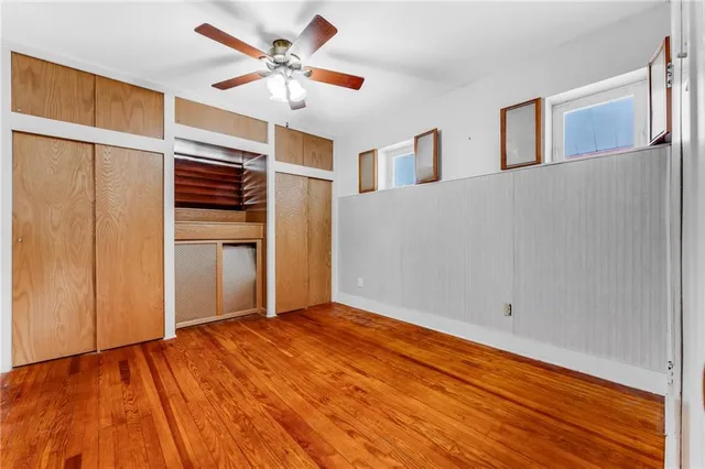 a view of a big room with wooden walls