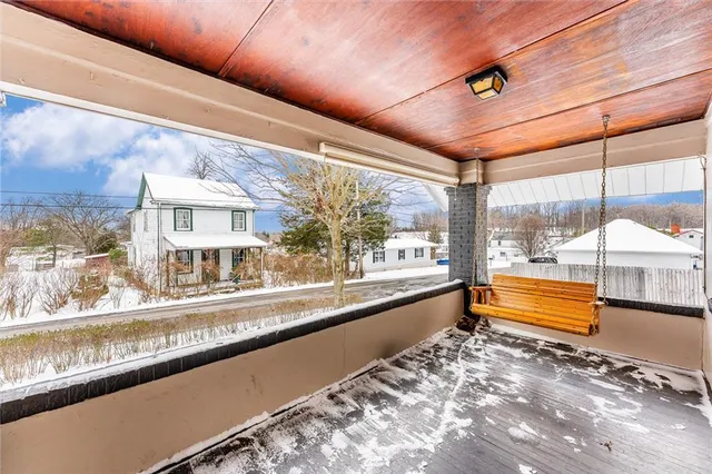 a large room with a large window and pool table