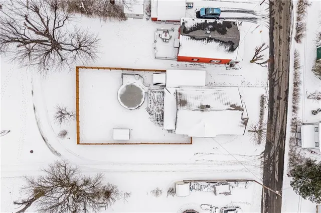 front view of a house with a wrought fence