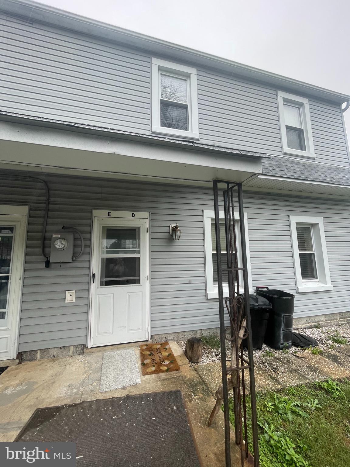 8627 1/2 Quentin Avenue Parkville, MD 21234 - Photo 11 of 11 a front view of a house with a yard and garage