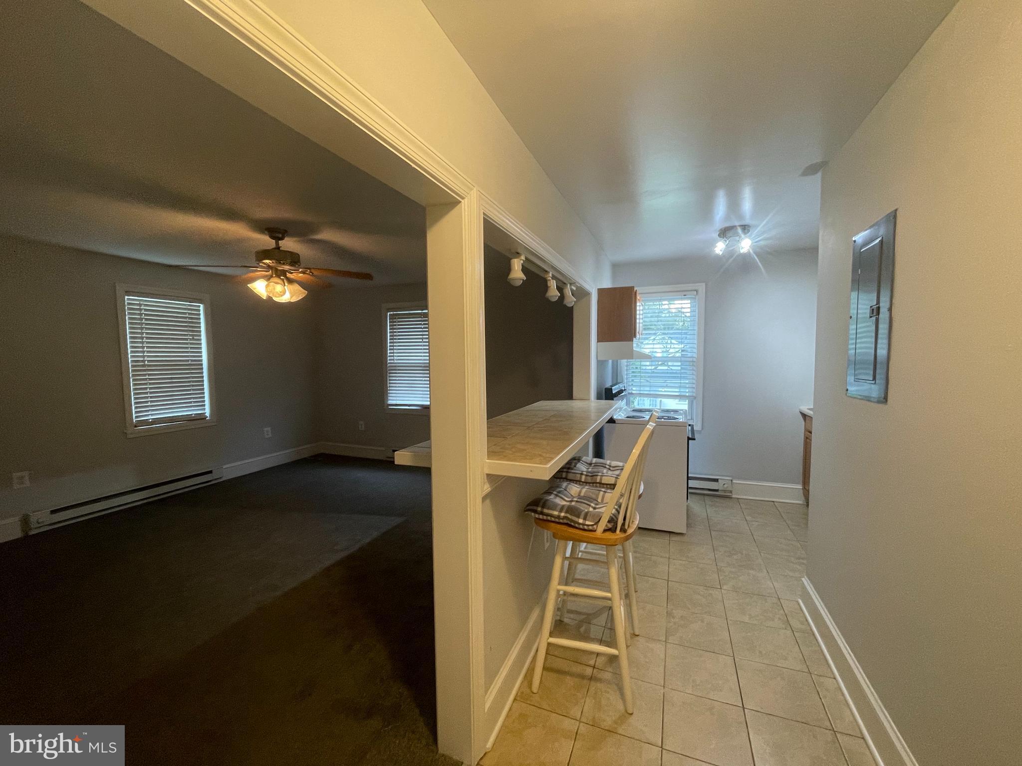 8627 1/2 Quentin Avenue Parkville, MD 21234 - Photo 5 of 11 a bathroom with a sink and a mirror