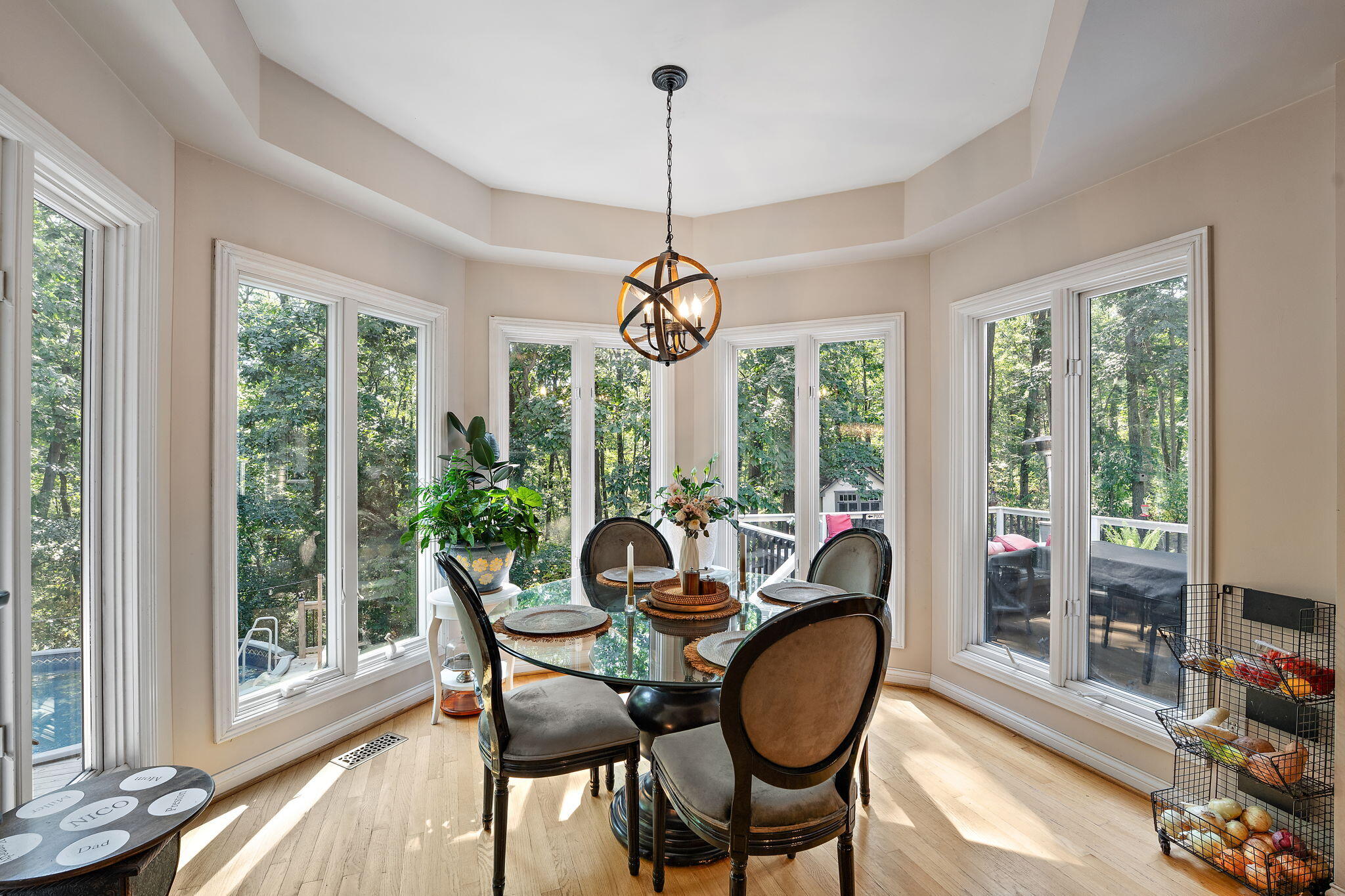 12275 South Williams Court Crown Point, IN 46307 - Photo 18 of 67 a dining room with furniture large windows and wooden floor