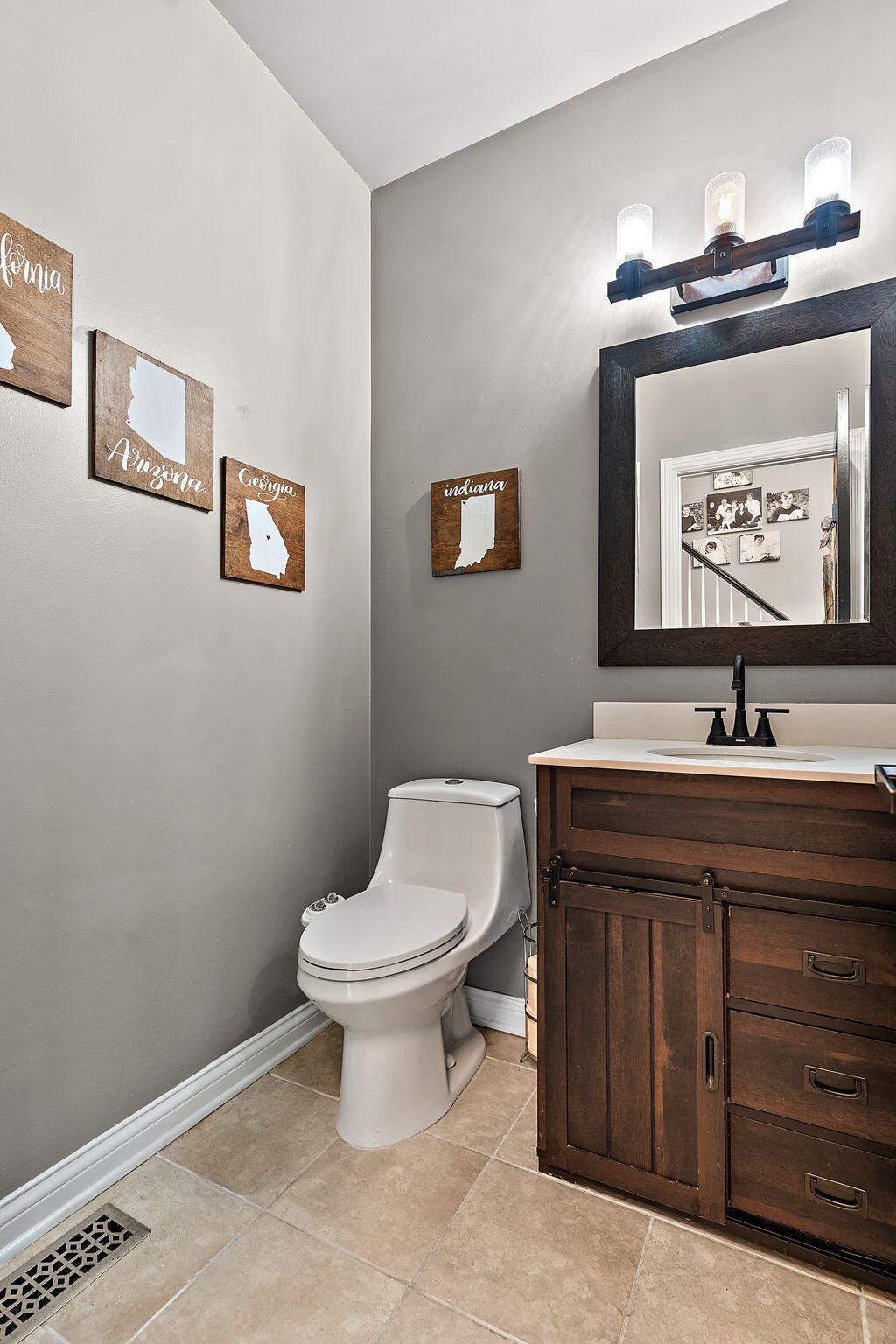 12275 South Williams Court Crown Point, IN 46307 - Photo 24 of 67 a bathroom with a toilet sink and mirror