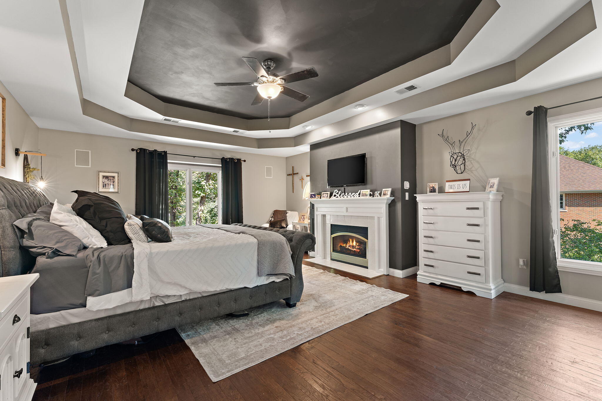 12275 South Williams Court Crown Point, IN 46307 - Photo 28 of 67 a spacious bedroom with a bed and a flat screen tv