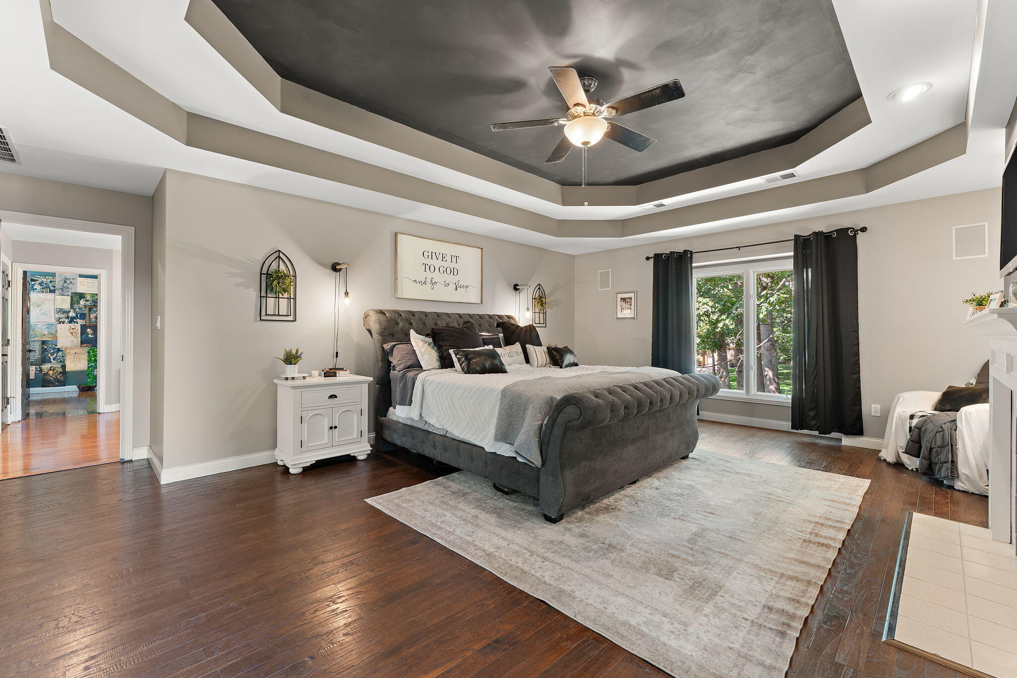 12275 South Williams Court Crown Point, IN 46307 - Photo 29 of 67 a bedroom with a large bed and a chandelier