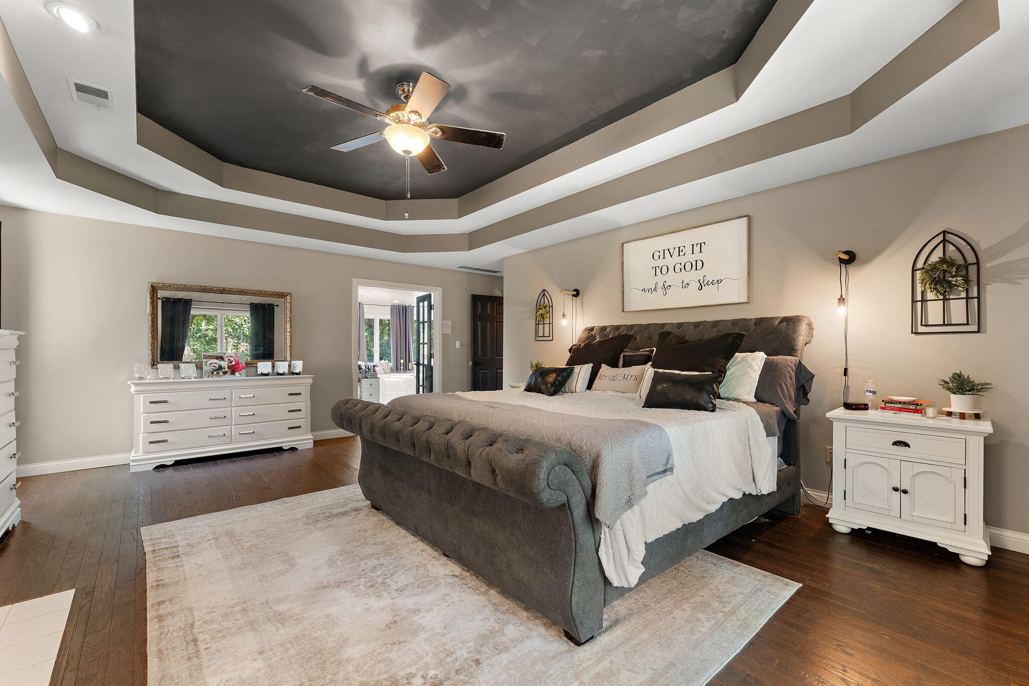 12275 South Williams Court Crown Point, IN 46307 - Photo 30 of 67 a spacious bedroom with a large bed and a chandelier