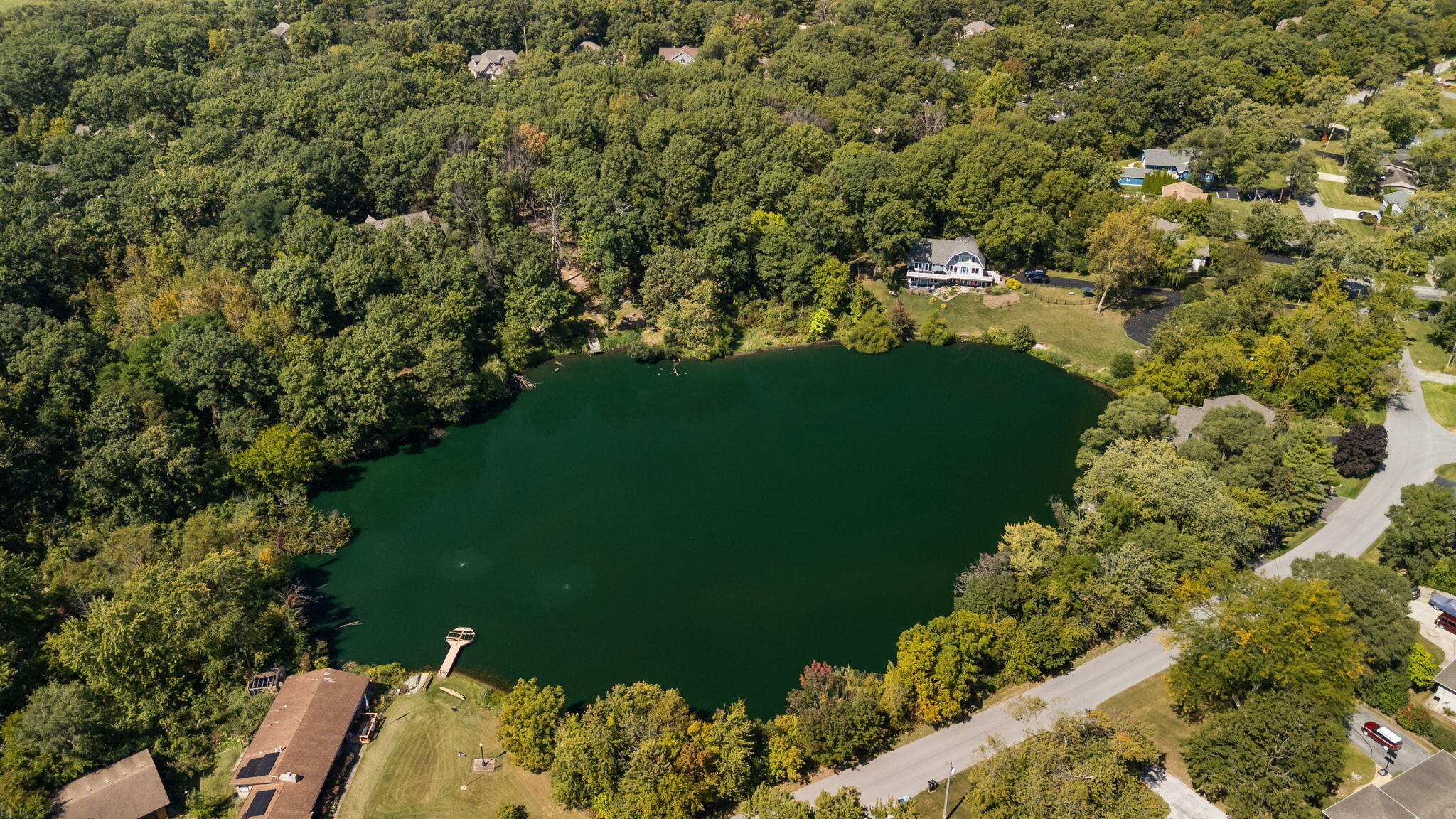 12275 South Williams Court Crown Point, IN 46307 - Photo 58 of 67 a view of a lake with a yard