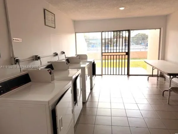a view of a kitchen with a large window