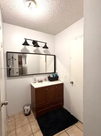 a kitchen with a stove and a refrigerator