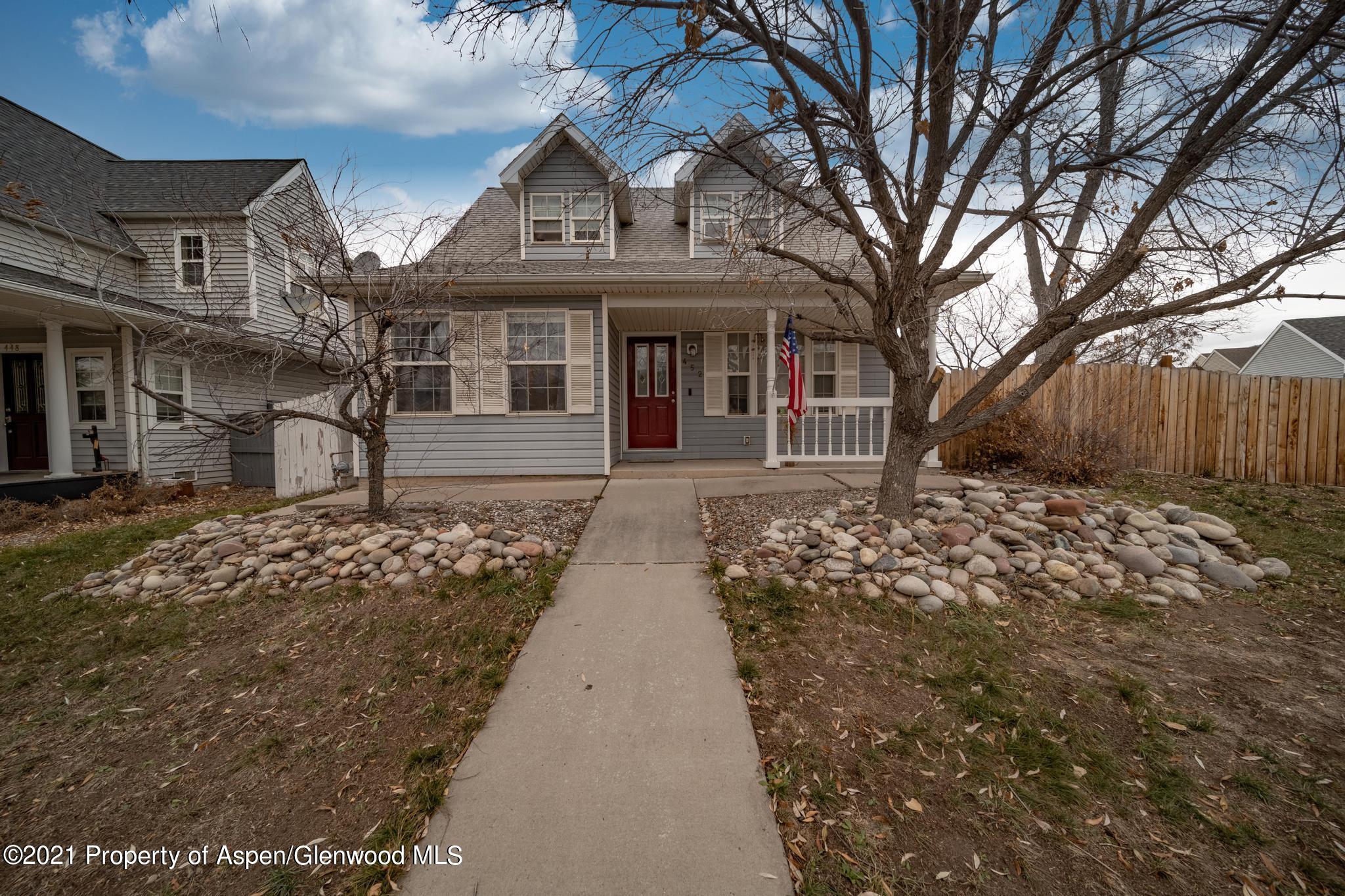 452 Evergreen Drive Rifle, CO 81650 - Photo 1 of 22 front view of a house with a large trees