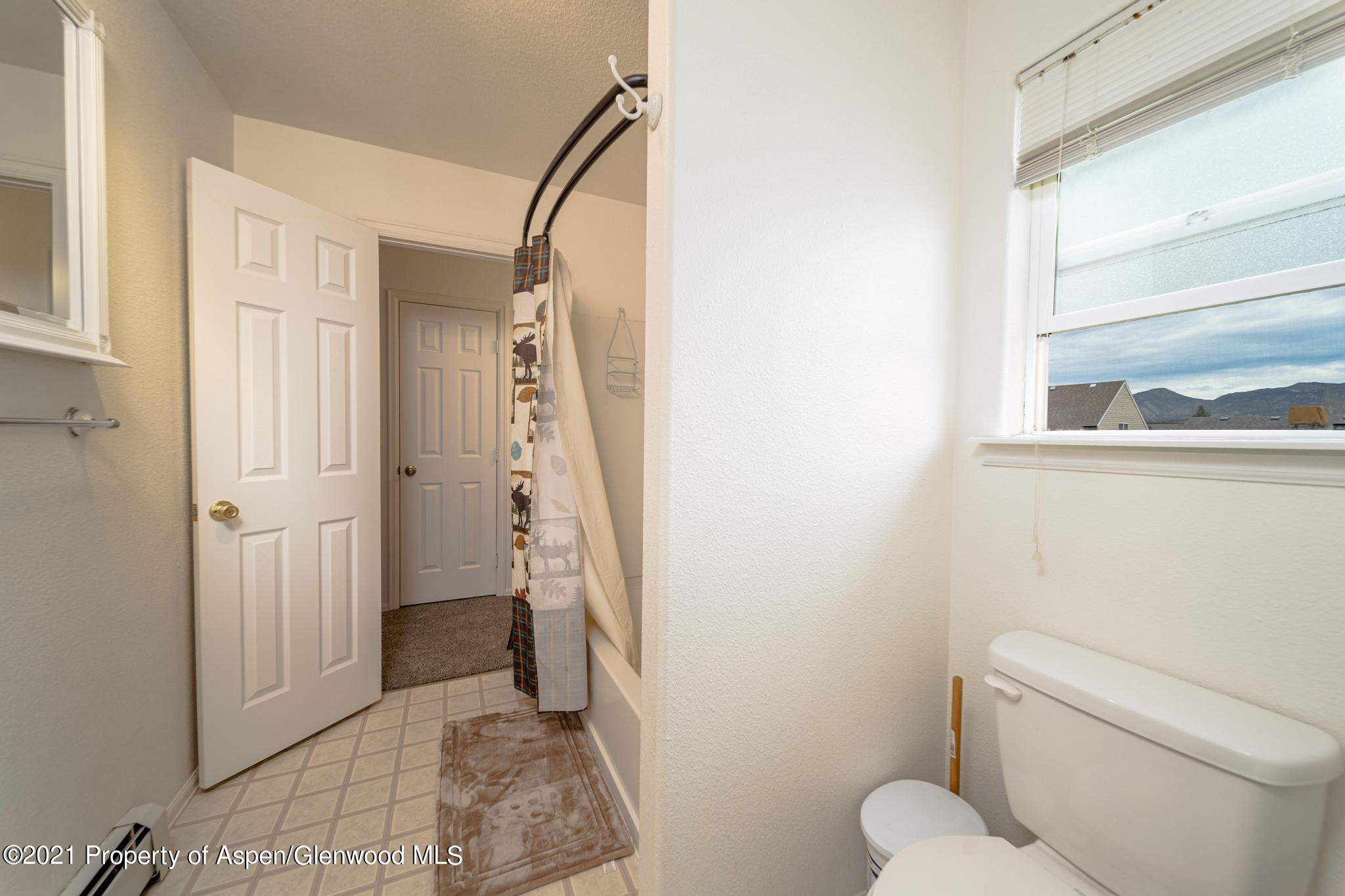 452 Evergreen Drive Rifle, CO 81650 - Photo 15 of 22 a bathroom with a toilet and a shower