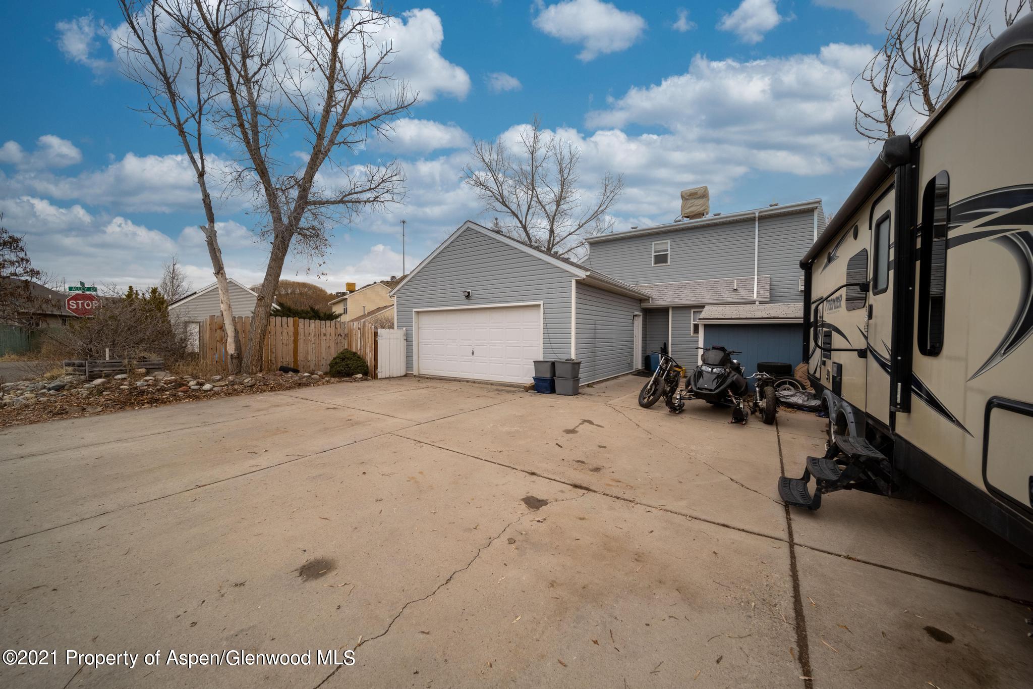 452 Evergreen Drive Rifle, CO 81650 - Photo 20 of 22 a view of a house with a tree