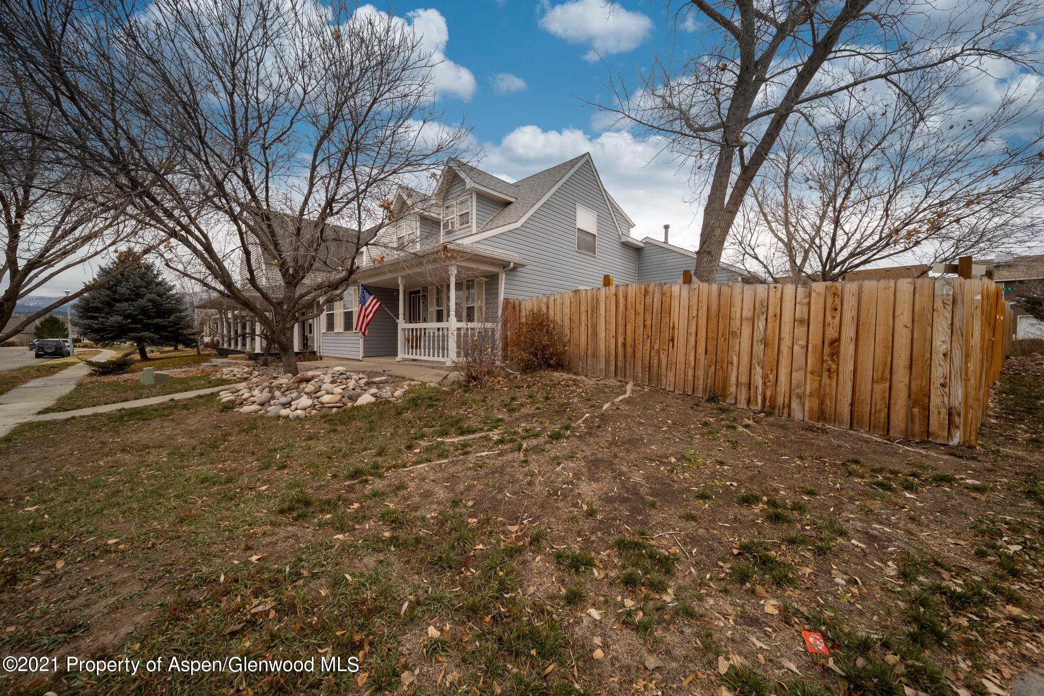 452 Evergreen Drive Rifle, CO 81650 - Photo 2 of 22 a view of a yard with wooden fence
