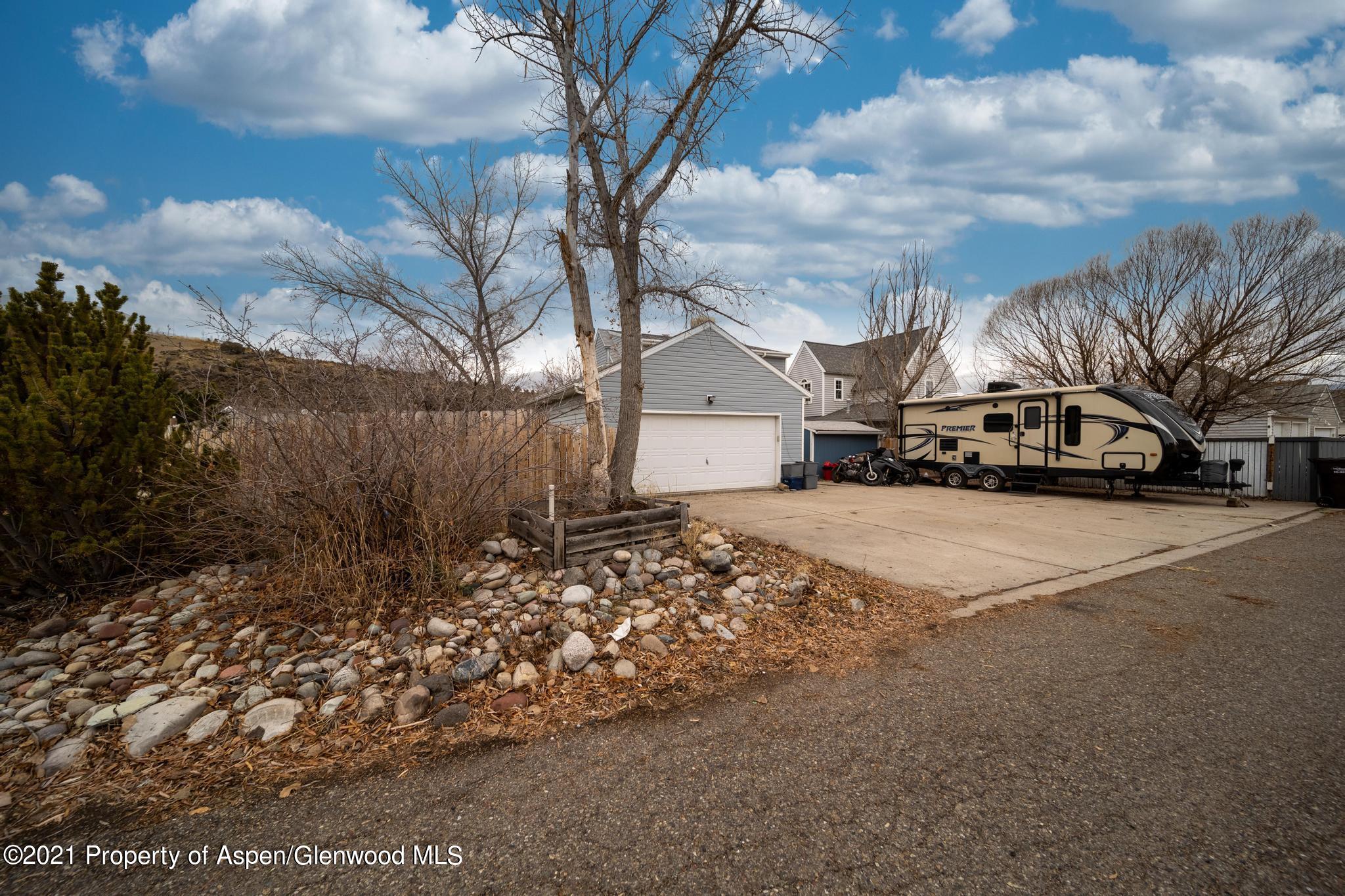 452 Evergreen Drive Rifle, CO 81650 - Photo 21 of 22 a view of road with large trees