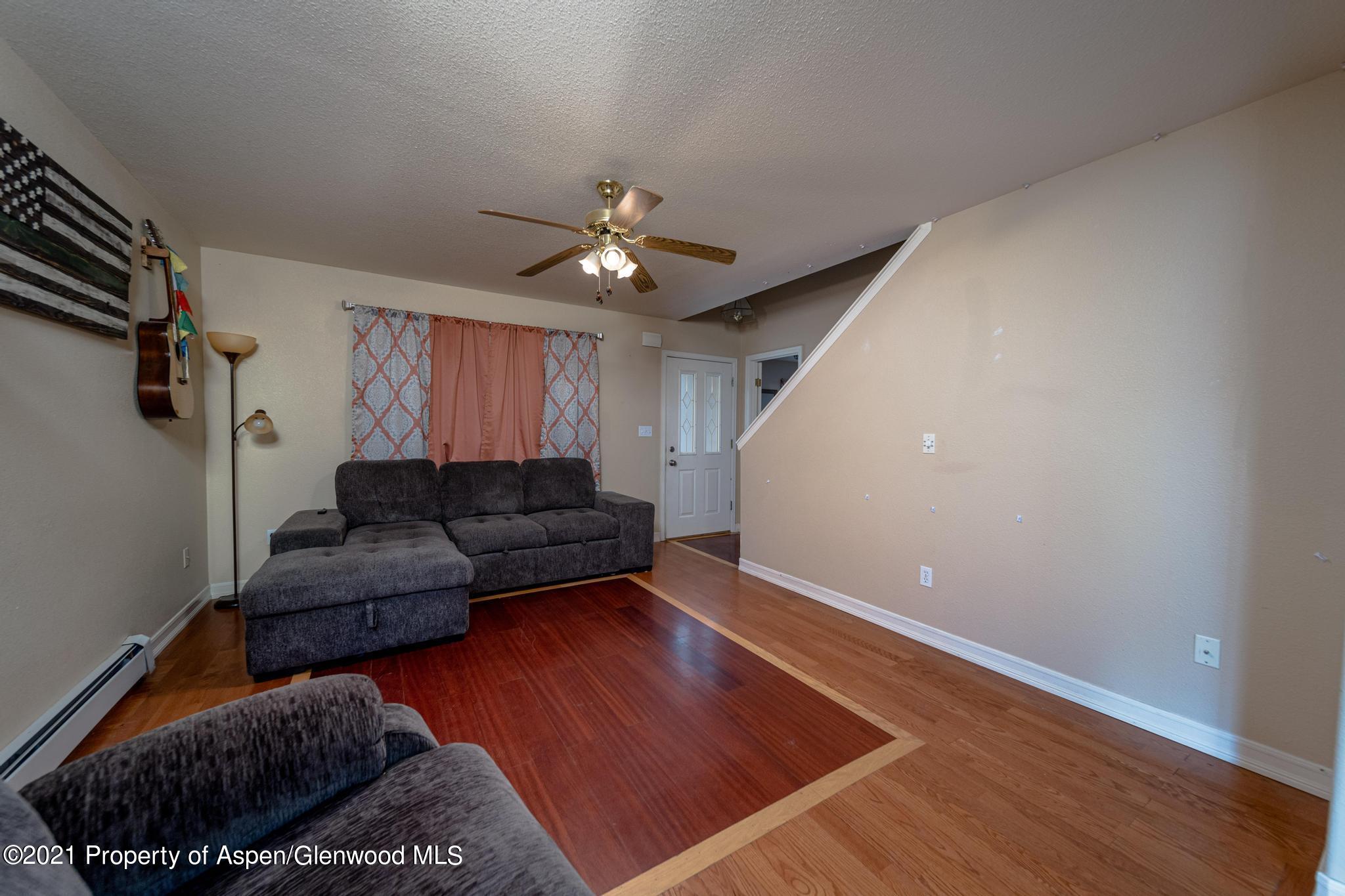 452 Evergreen Drive Rifle, CO 81650 - Photo 6 of 22 a living room with furniture and a rug