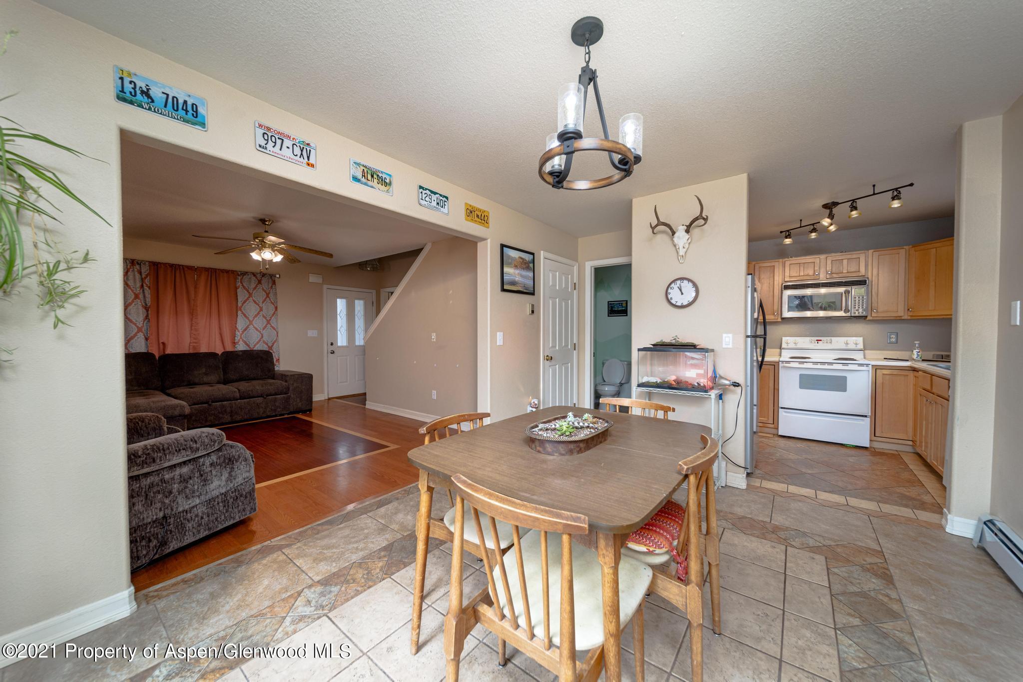 452 Evergreen Drive Rifle, CO 81650 - Photo 8 of 22 a open kitchen with stainless steel appliances granite countertop a stove and a sink
